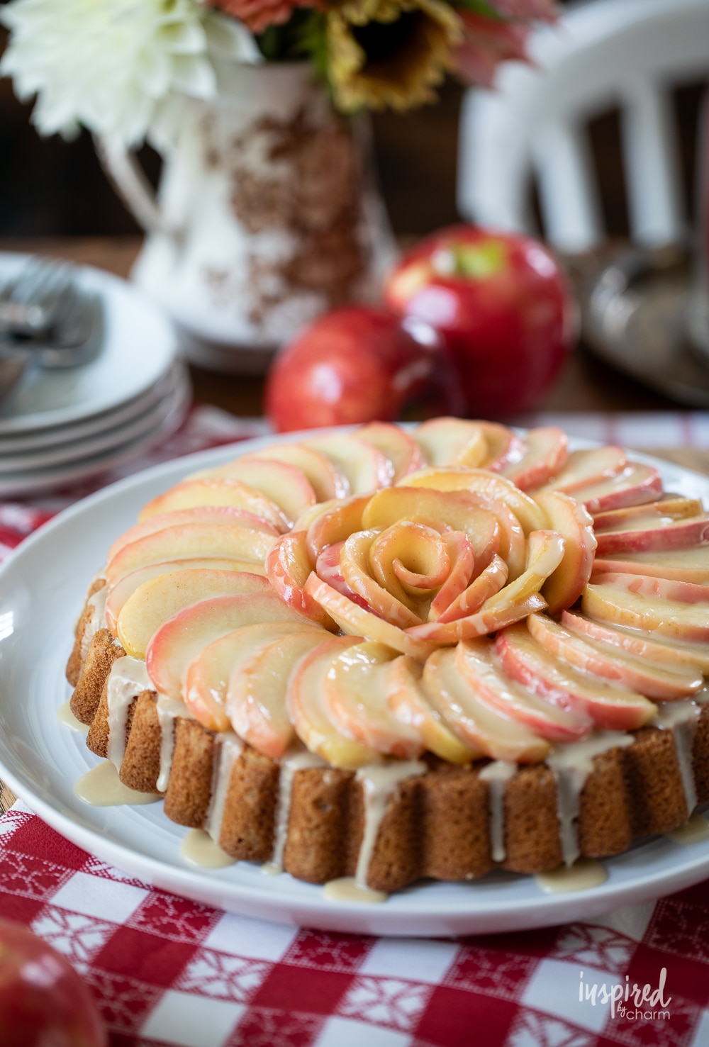 cake with fresh apple slices swirled on the top.