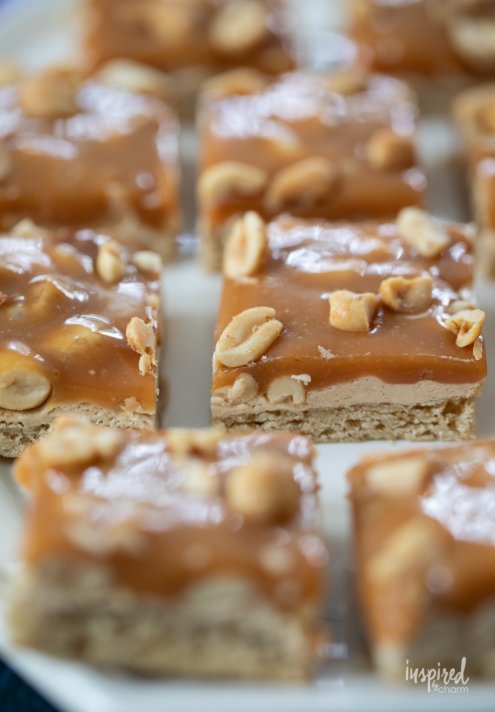 close up photo of one salted peanut bars on a plate.