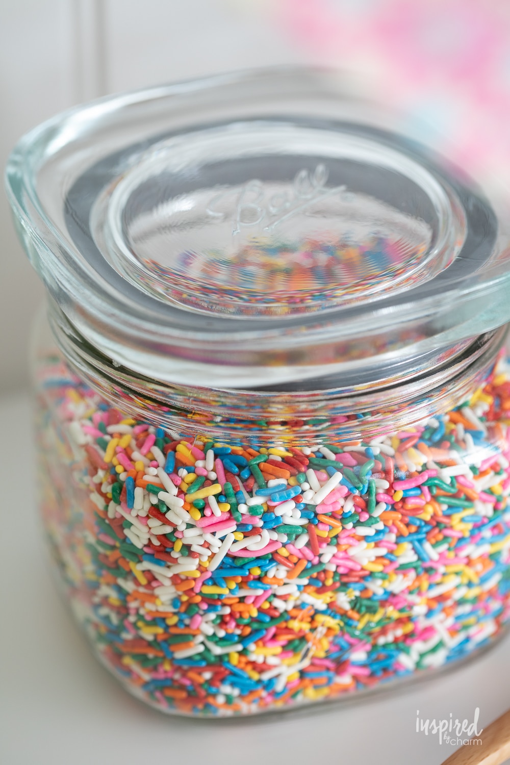 jar filled with colorful ice cream sprinkles.
