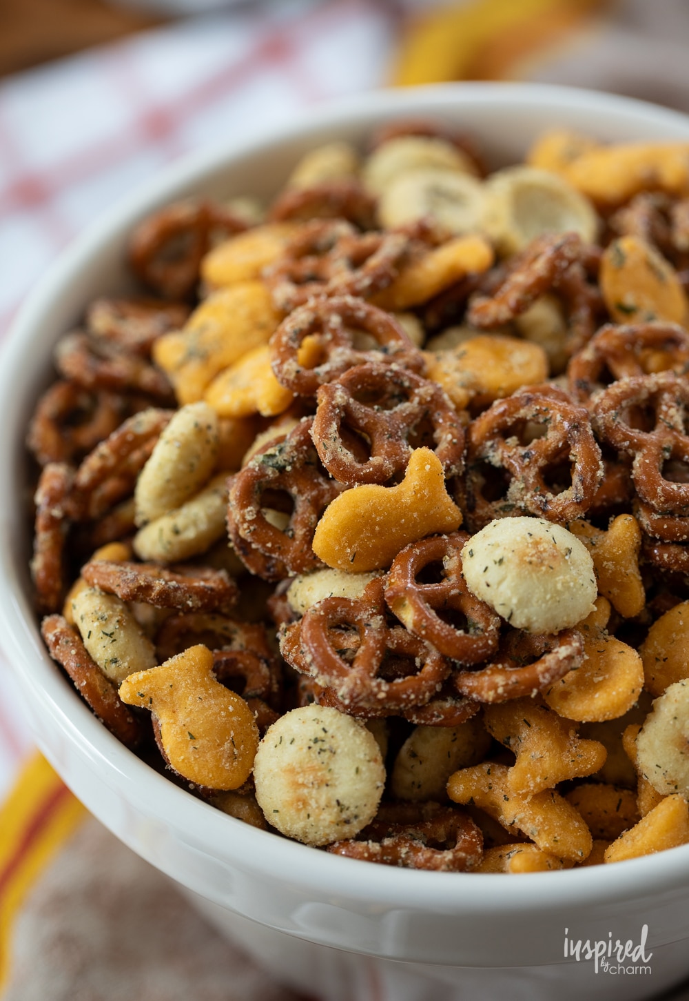 close up of ranch pretzel, goldfish crackers, and oyster cracker snack mix.