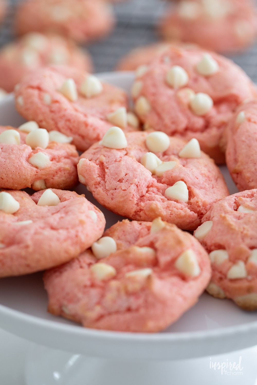 plate of strawberry cake mix cookies with white chocolate chips. 