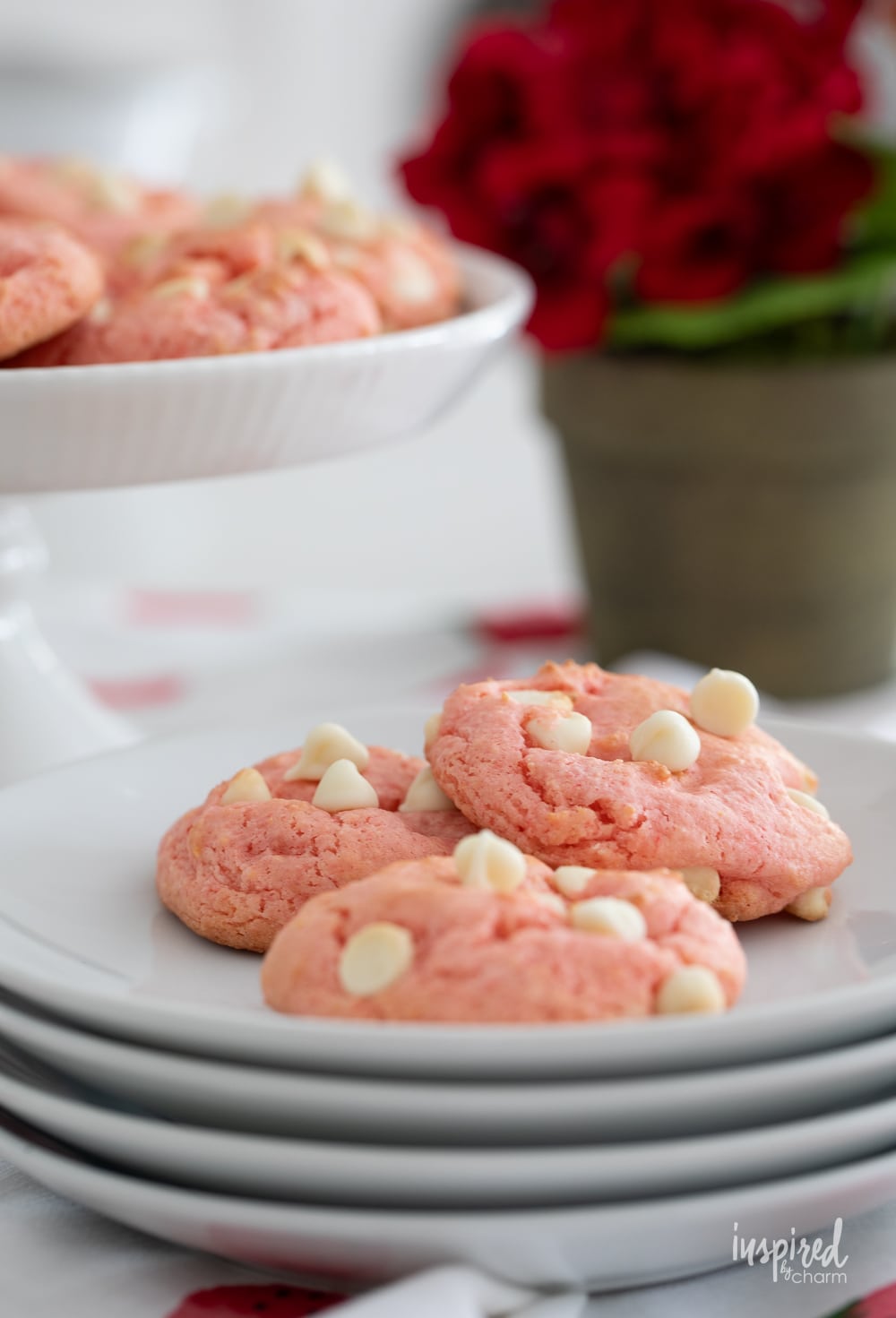 a plate of three strawberry cake mix cookies.