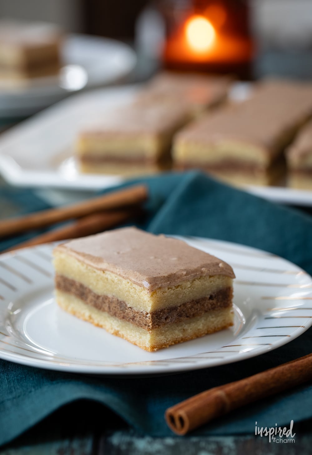 brown sugar cinnamon pop tart bars served in the background with one on a small plate in the front.