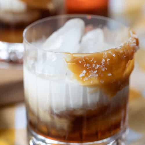 rocks glass with butterscotch sauce garnish and filled with butterscotch white russian.