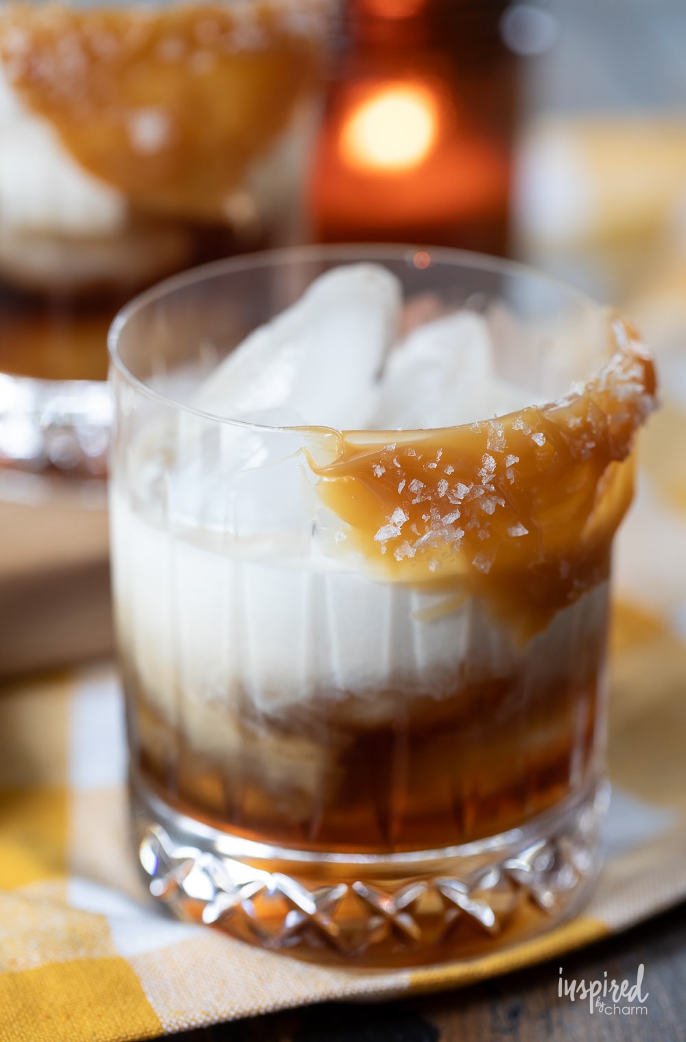 rocks glass with butterscotch sauce garnish and filled with butterscotch white russian. 