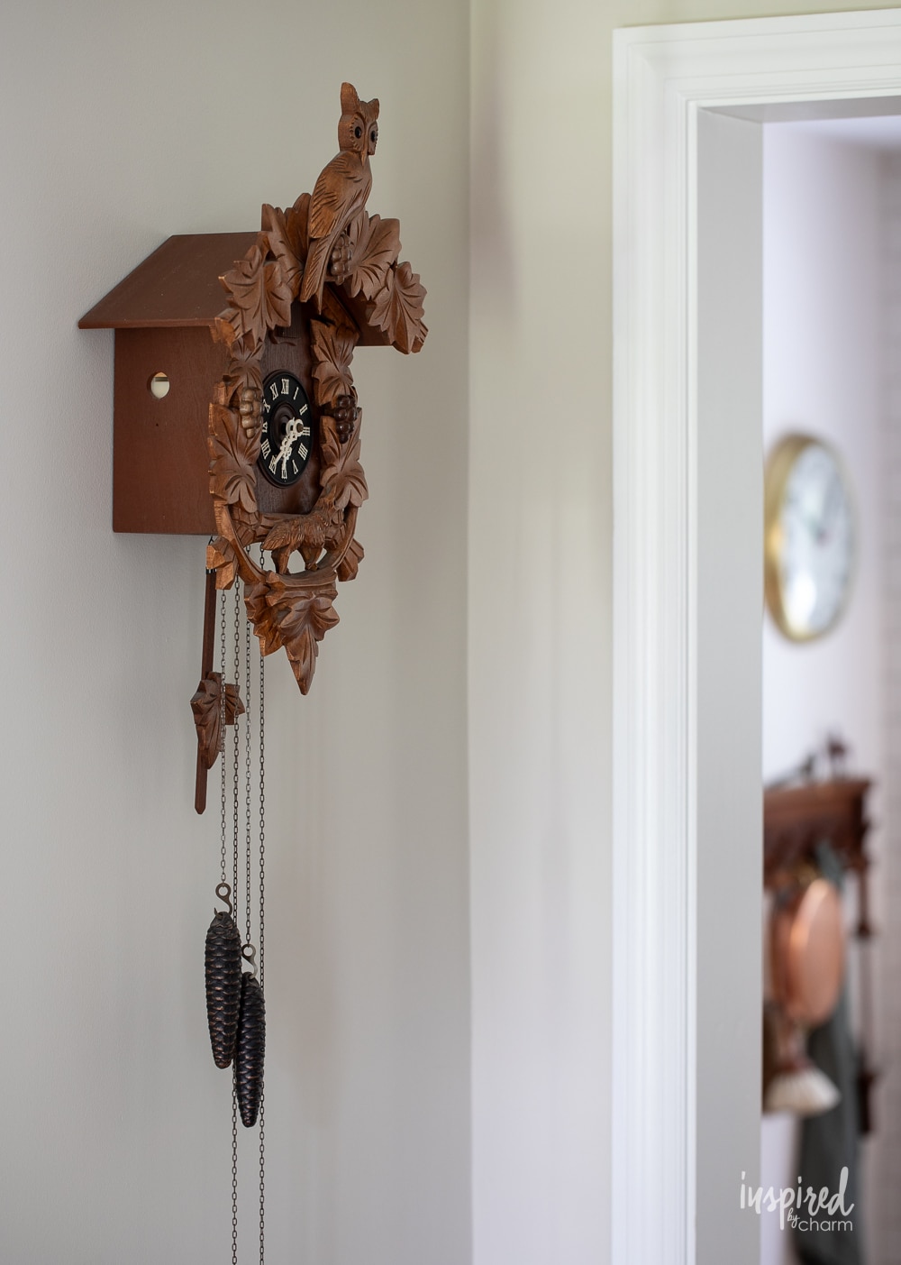 large cuckoo clock hung on the wall. 