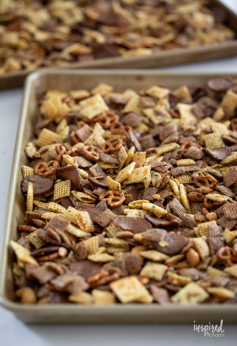 dill pickle snack mix on a large baking sheet pan.
