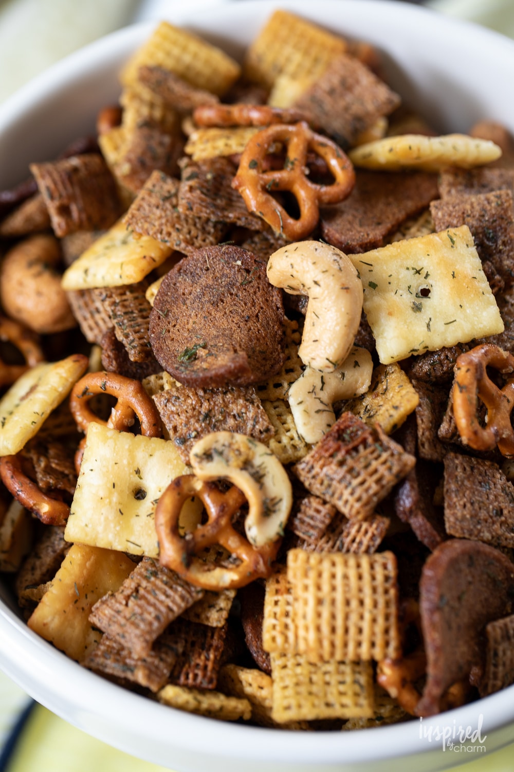 close up of dill pickle snack mix in a bowl.