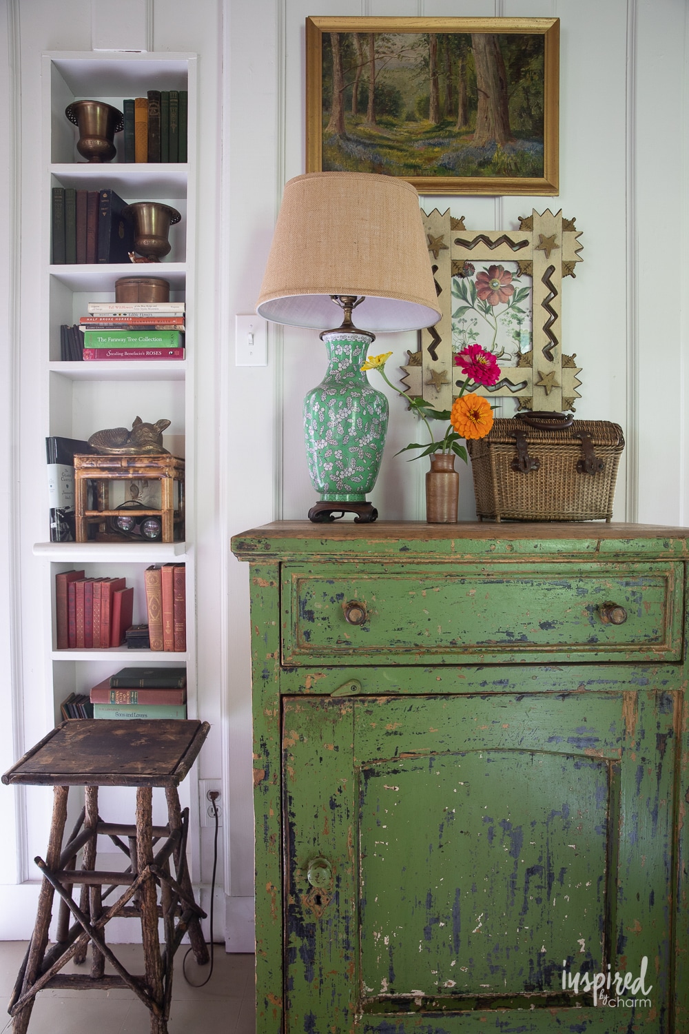 rustic green dresser with vintage lamp. 