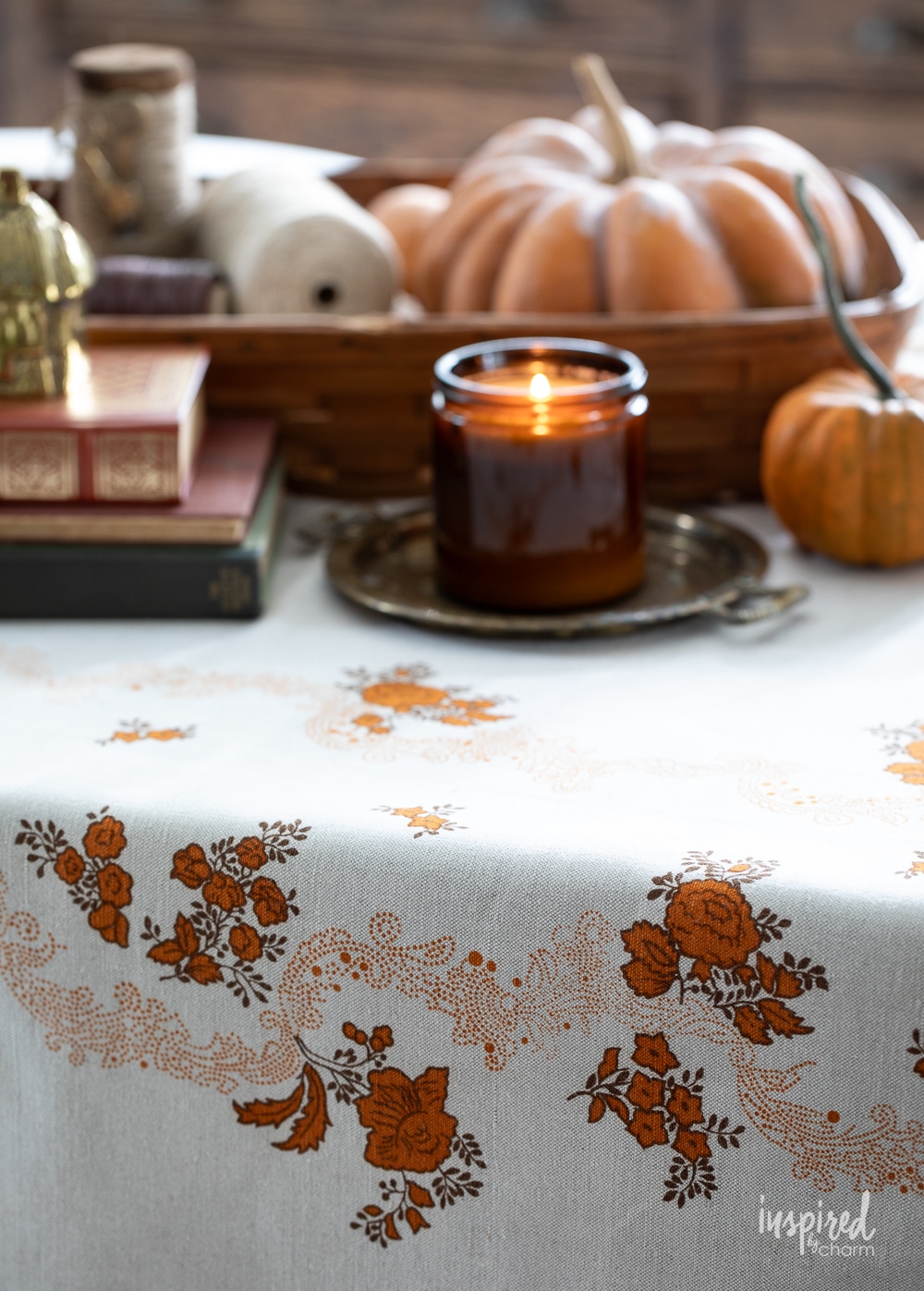 vintage tablecloth with fall decor styled on top. 
