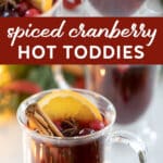two spiced cranberry hot toddies in glass mugs.