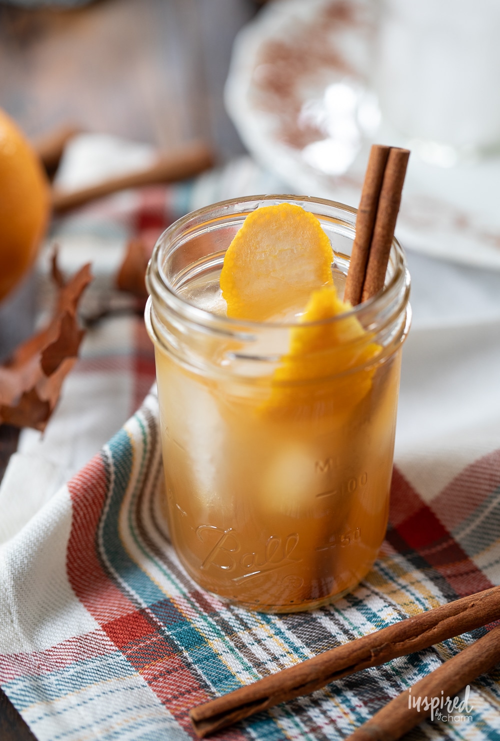 single apple cider whiskey sour in a jar. 