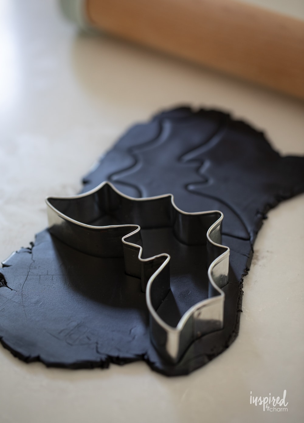bat cookie cutter cutting black oven-bake clay.