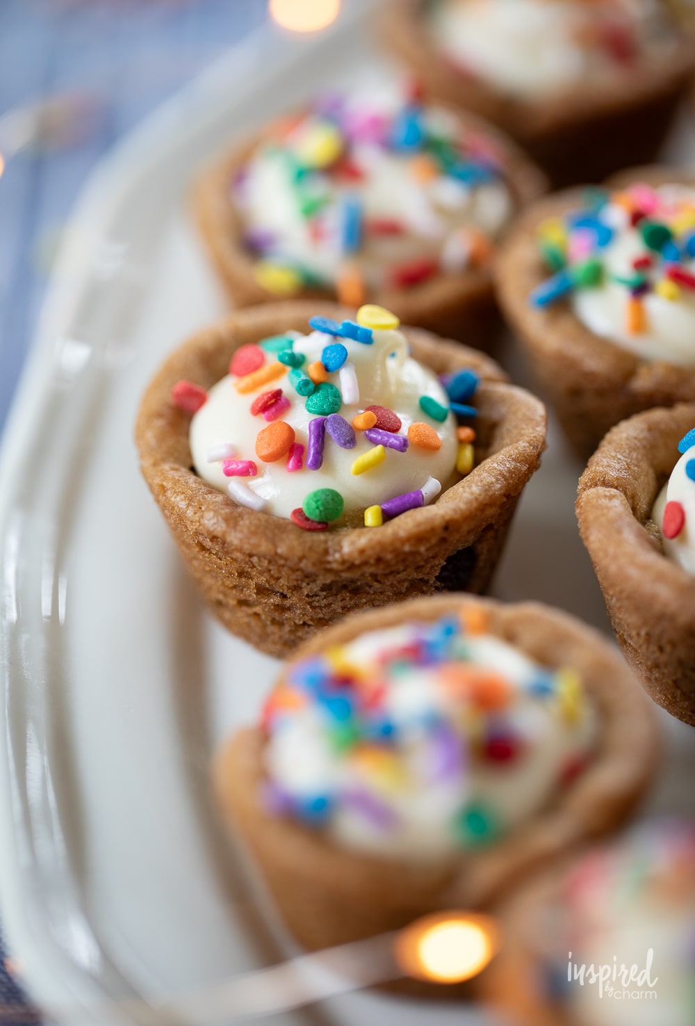 mini cheesecake cooke cups with colorful sprinkles.