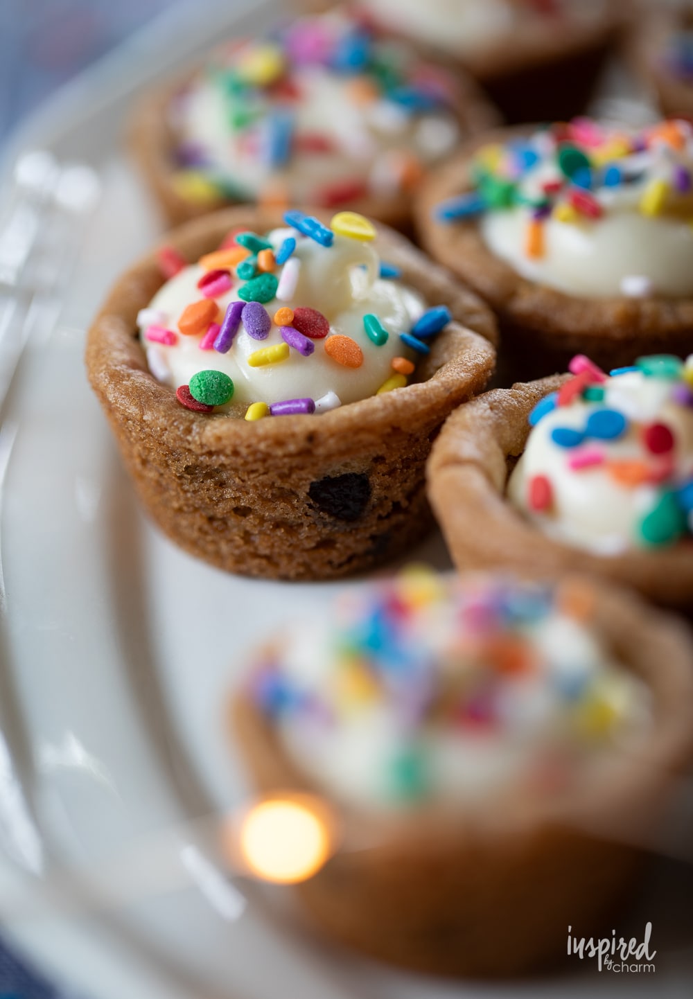 cheesecake cookie cups with colorful rainbow sprinkles.