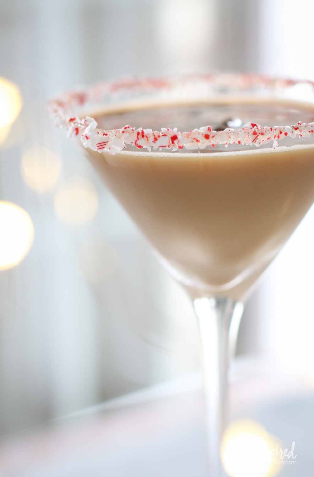 peppermint espresso martini with crushed candy cane on the rim.