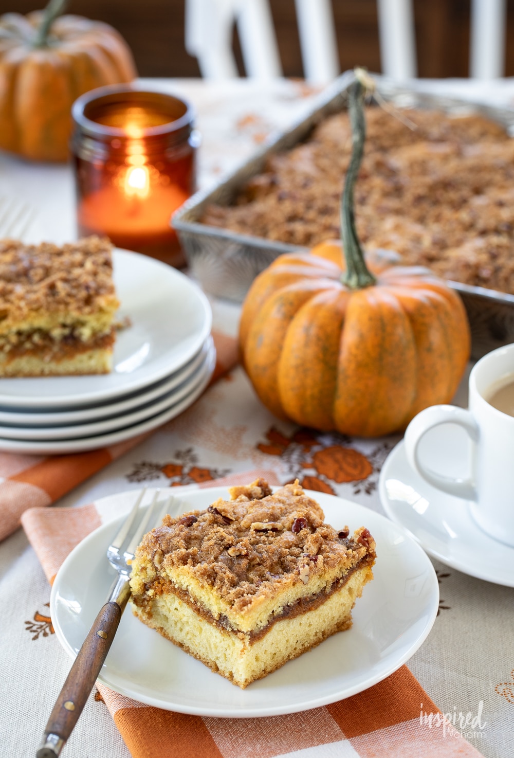 pumpkin swirl coffee cake served on plates and in metal pan.