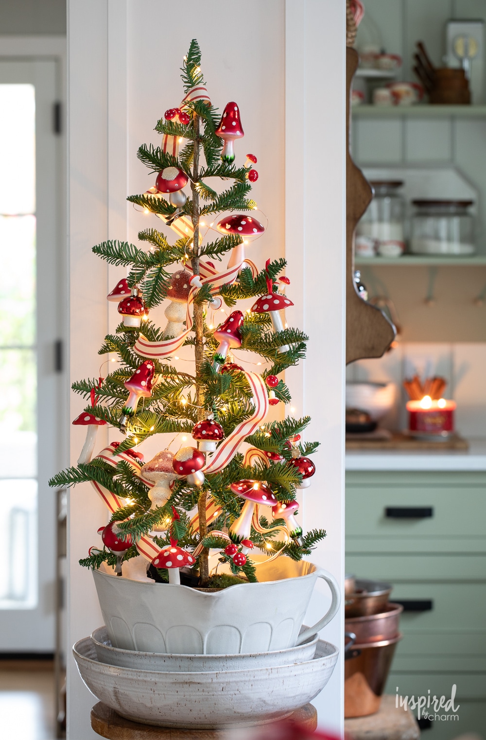 tabletop christmas tree with glass christmas ornaments.
