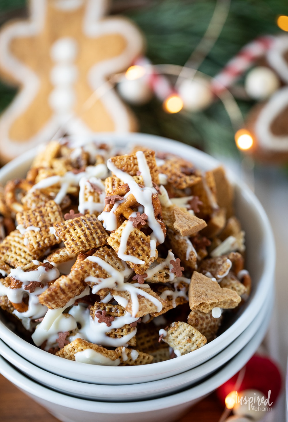 small serving bowl of festive gingerbread chex mix.