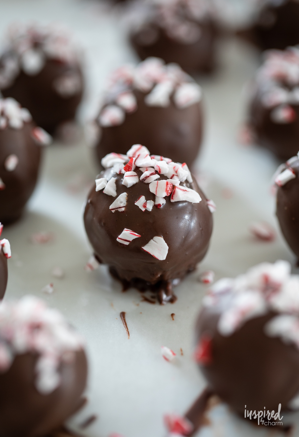 peppermint Oreo truffles sprinkled with crushed peppermint pieces.