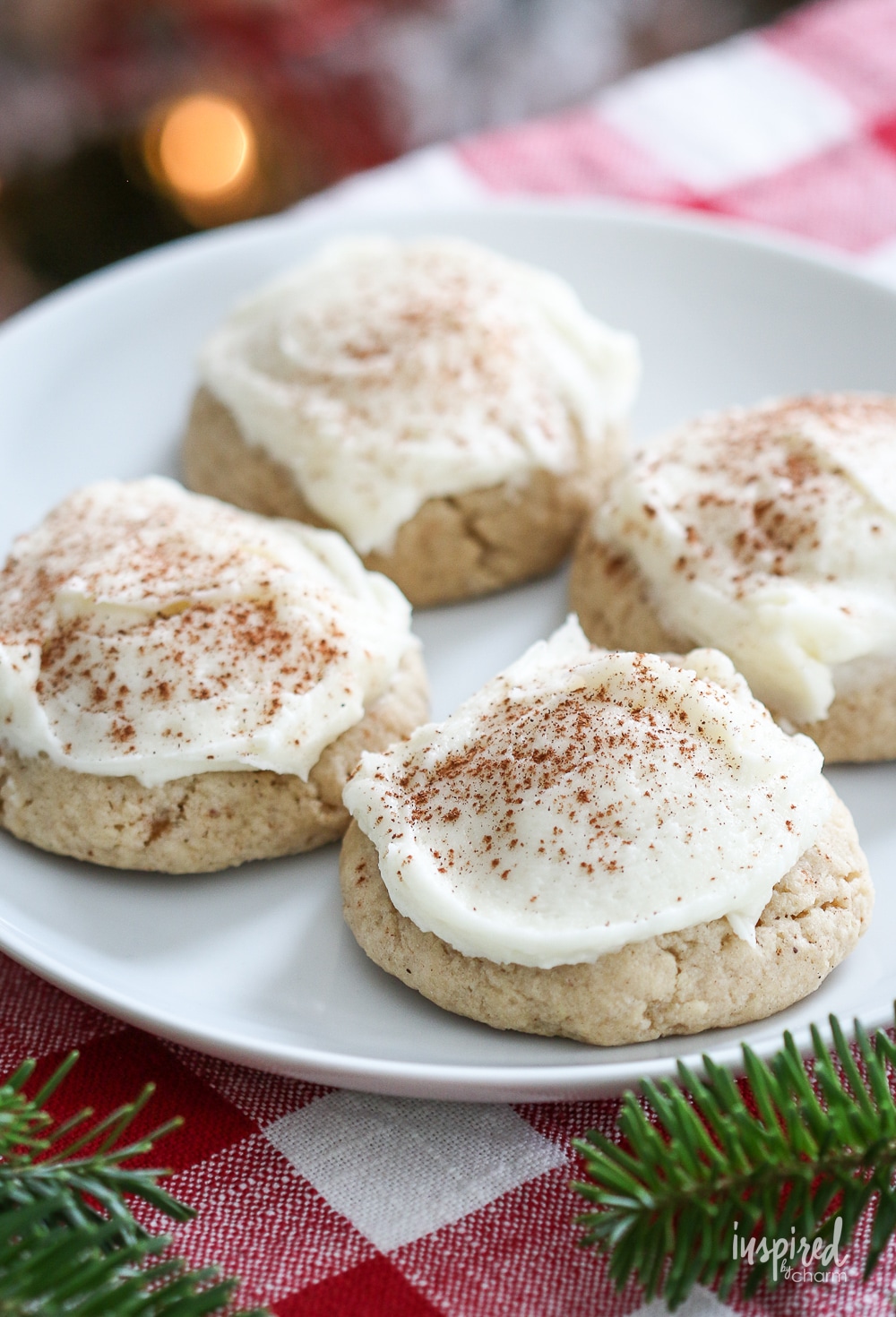 frosted eggnog cookies on a plate.