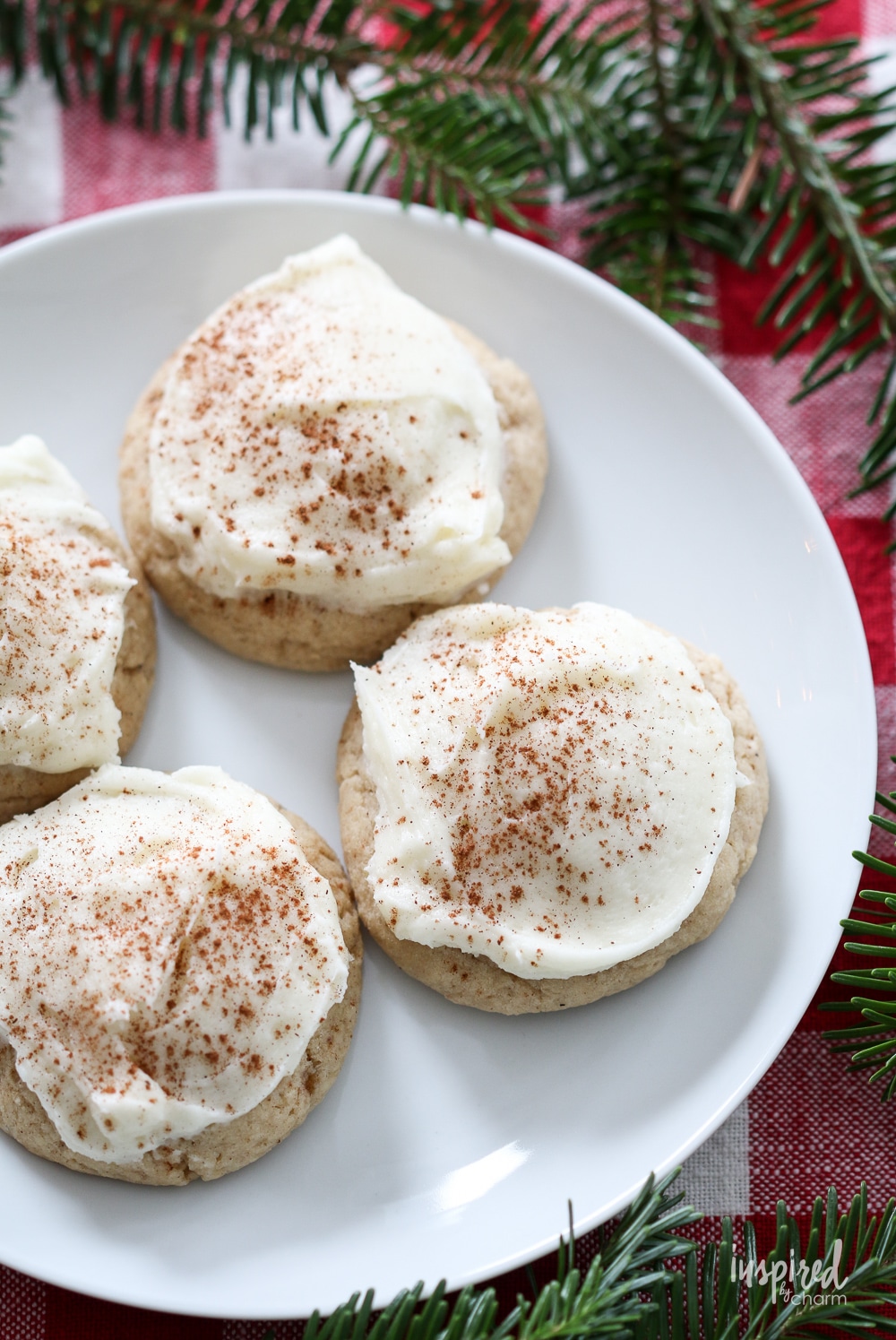 frosted eggnog cookies on a plate. 