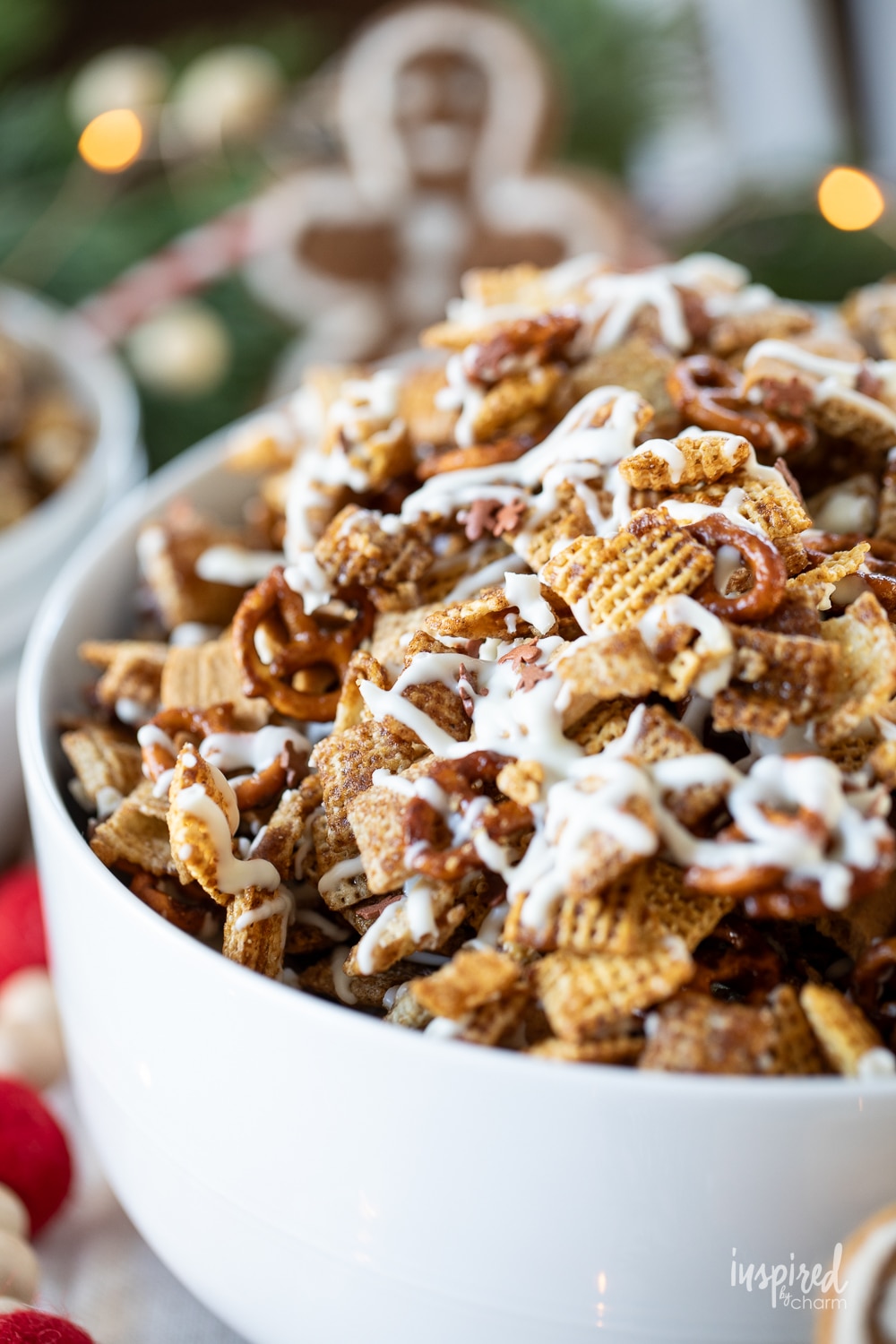 large white bowl of gingerbread chex mix.