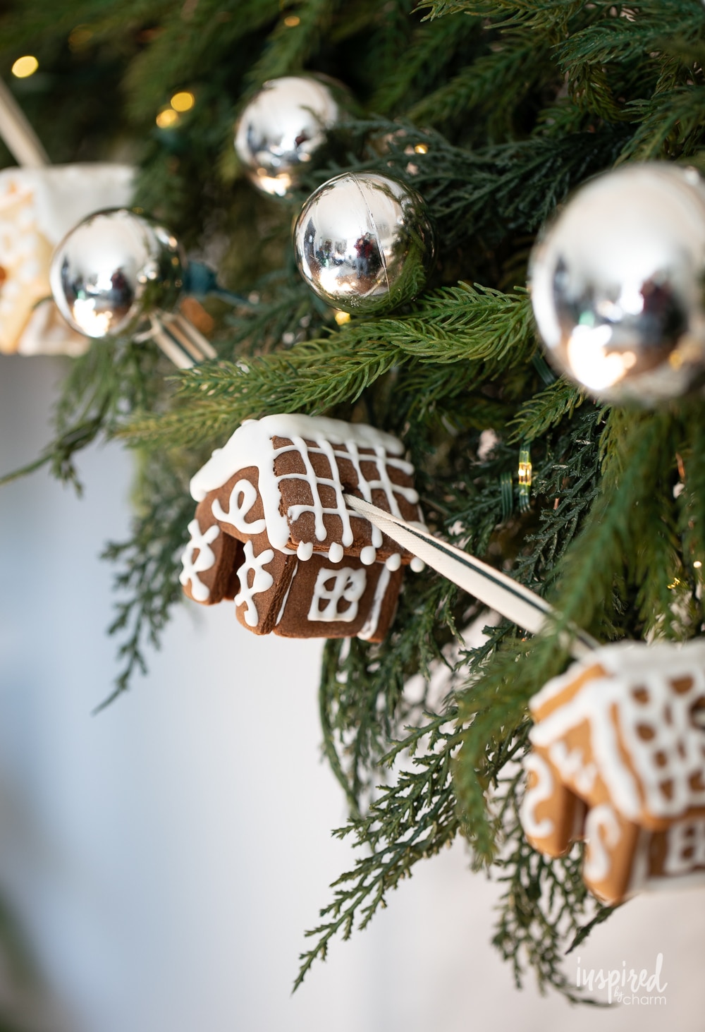 mini gingerbread houses with ribbon as a garland.