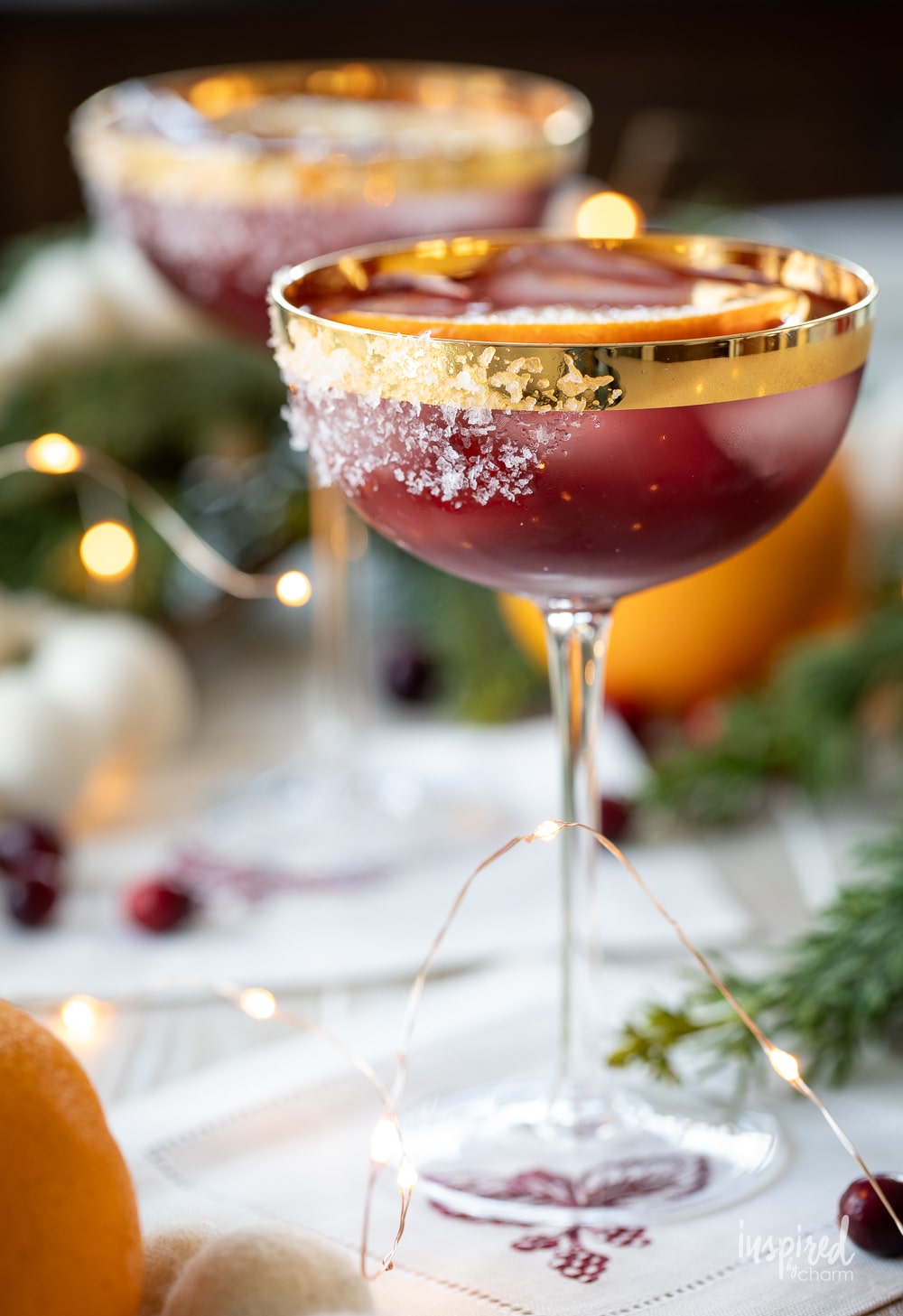 mulled wine margaritas in coupe glasses. 