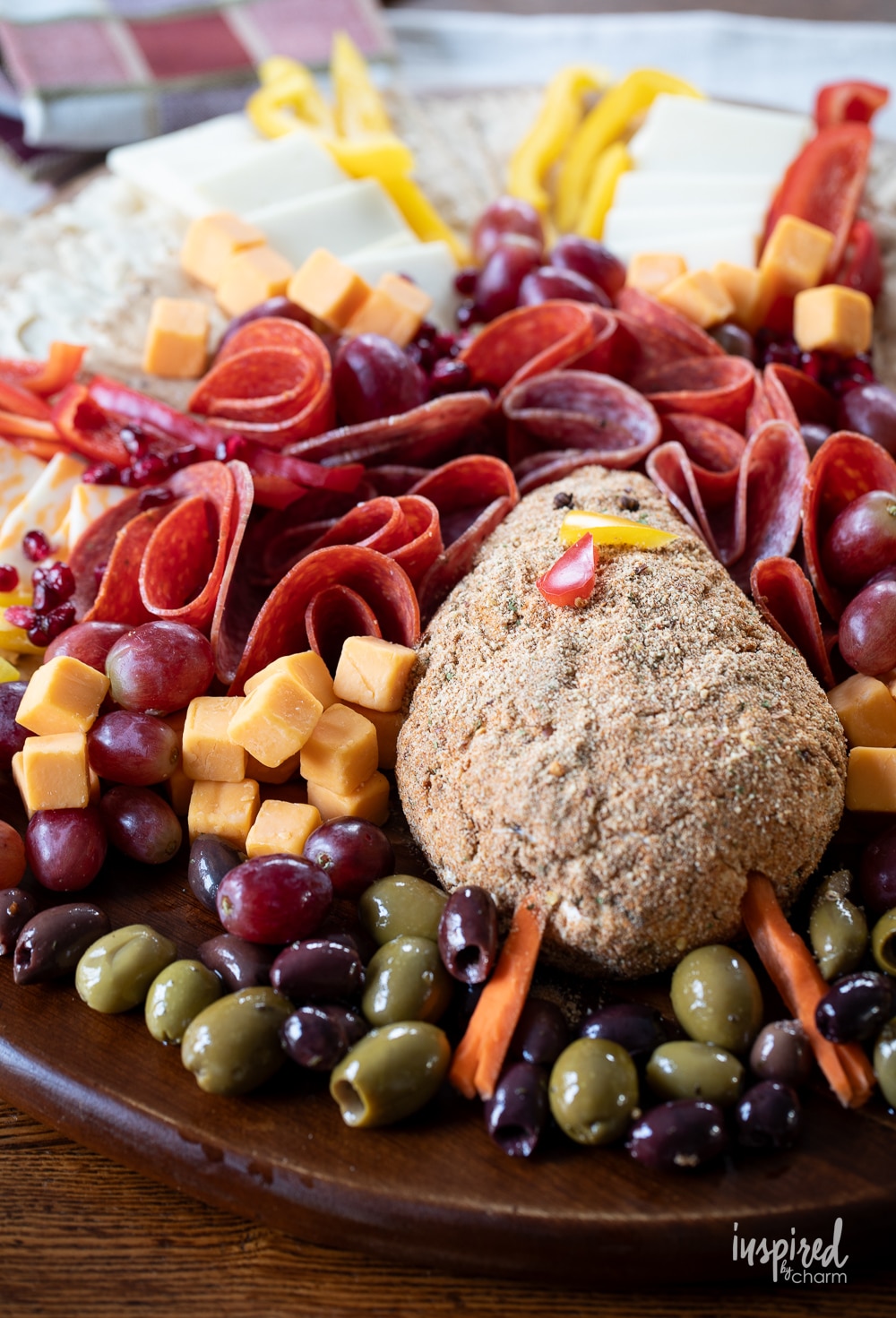 adorable turkey cheese ball part of a cheese charcuterie.