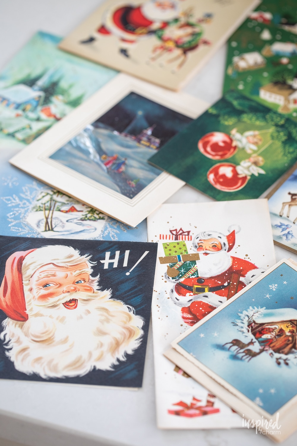 array of vintage christmas cards on a tabletop.