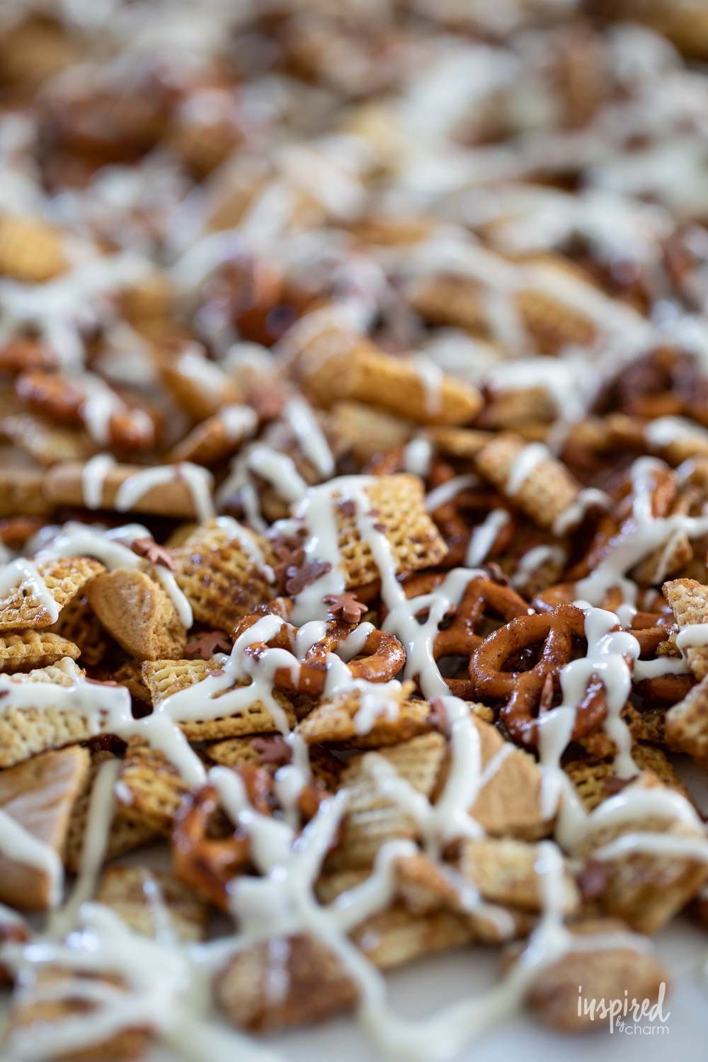 gingerbread chex mix drizzled with white chocolate.
