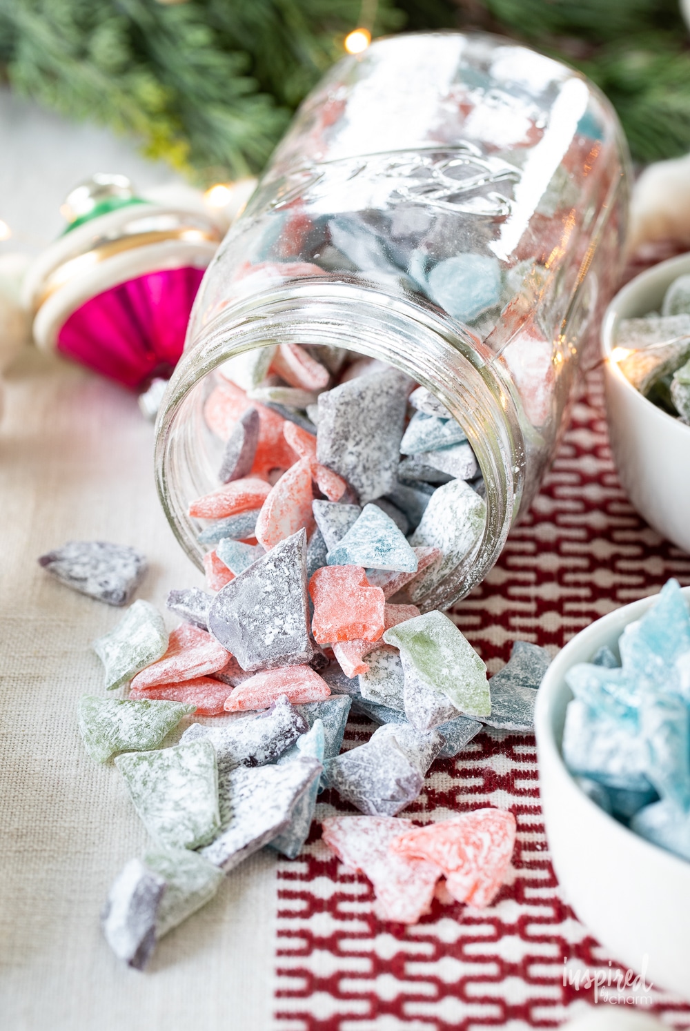glass jar on it's side with hard tack candy spilling out. 