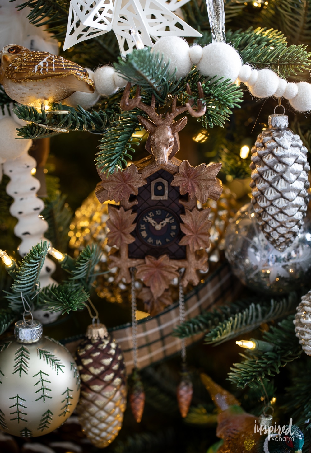 cuckoo clock ornament on a christmas tree.