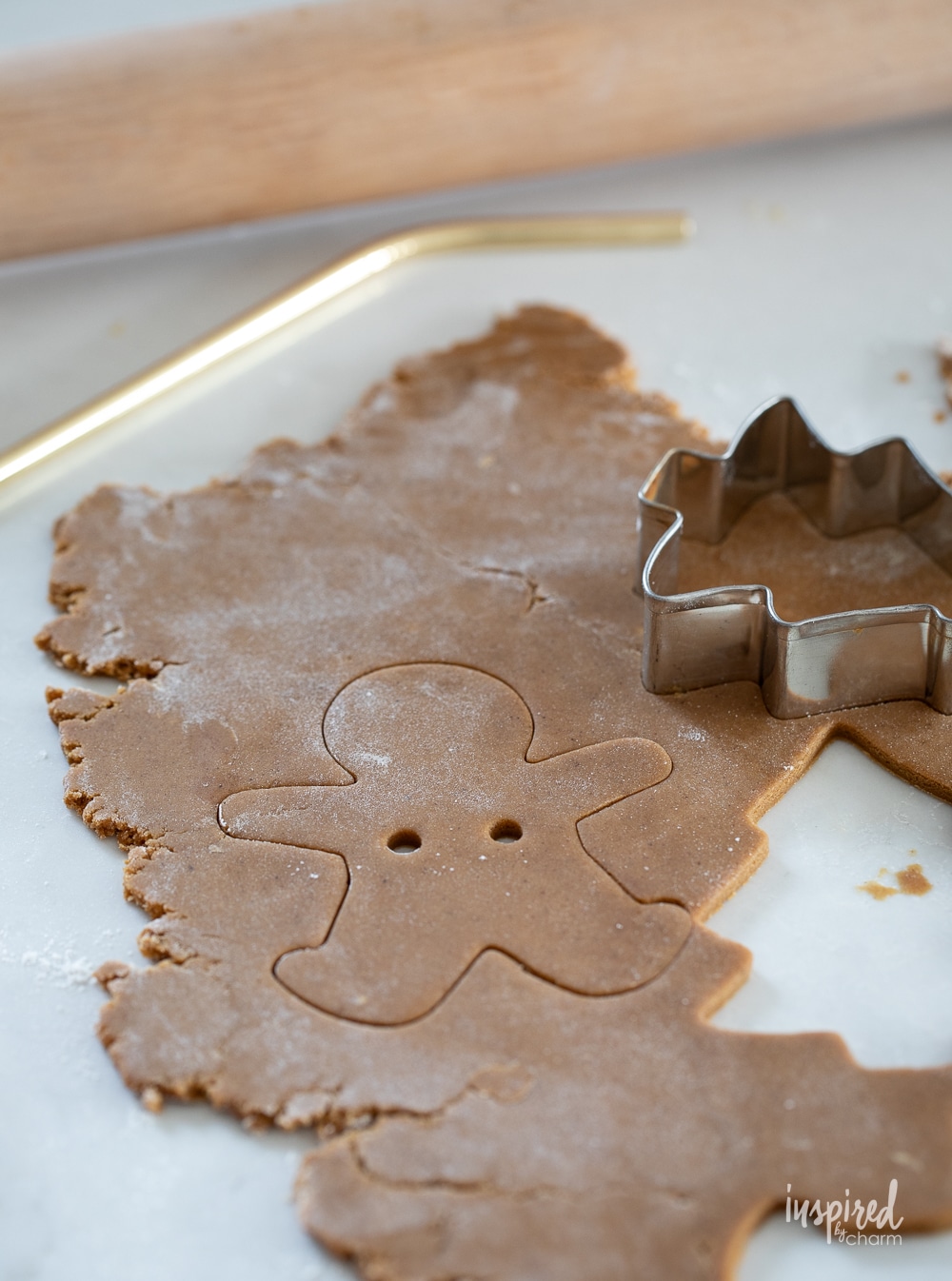 gingerbread dough rolled out with cookie cutter.