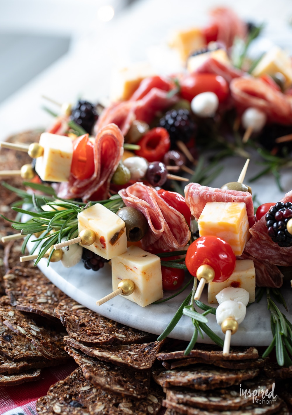 antipasto kabobs served with crackers. 