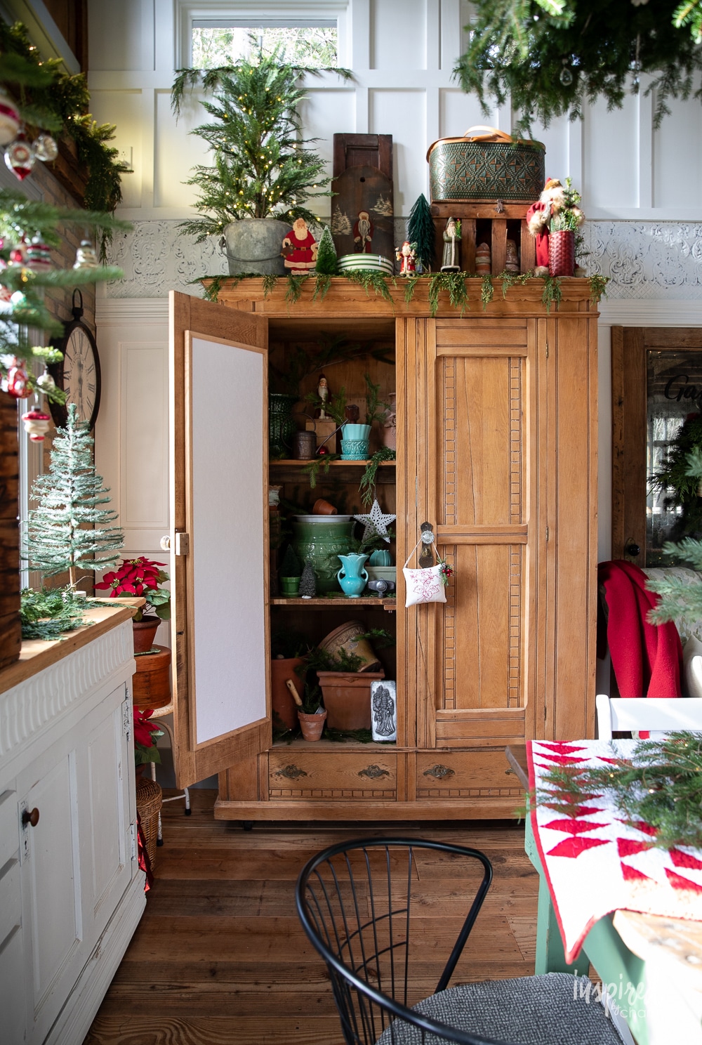 beautiful large pine cabinet filled with potting shed treasures.