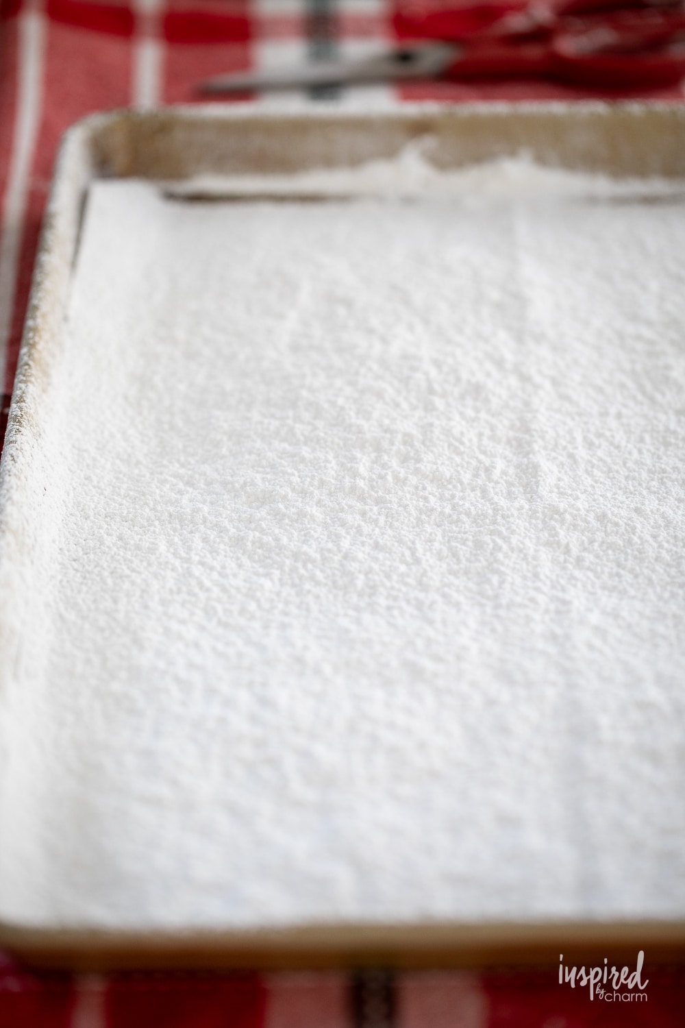 powdered sugar on parchment paper in a sheet pan. 