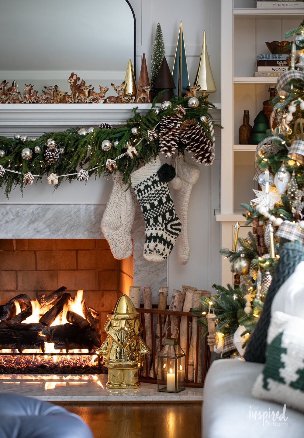 mantel decorated for Christmas with garland and stocking.