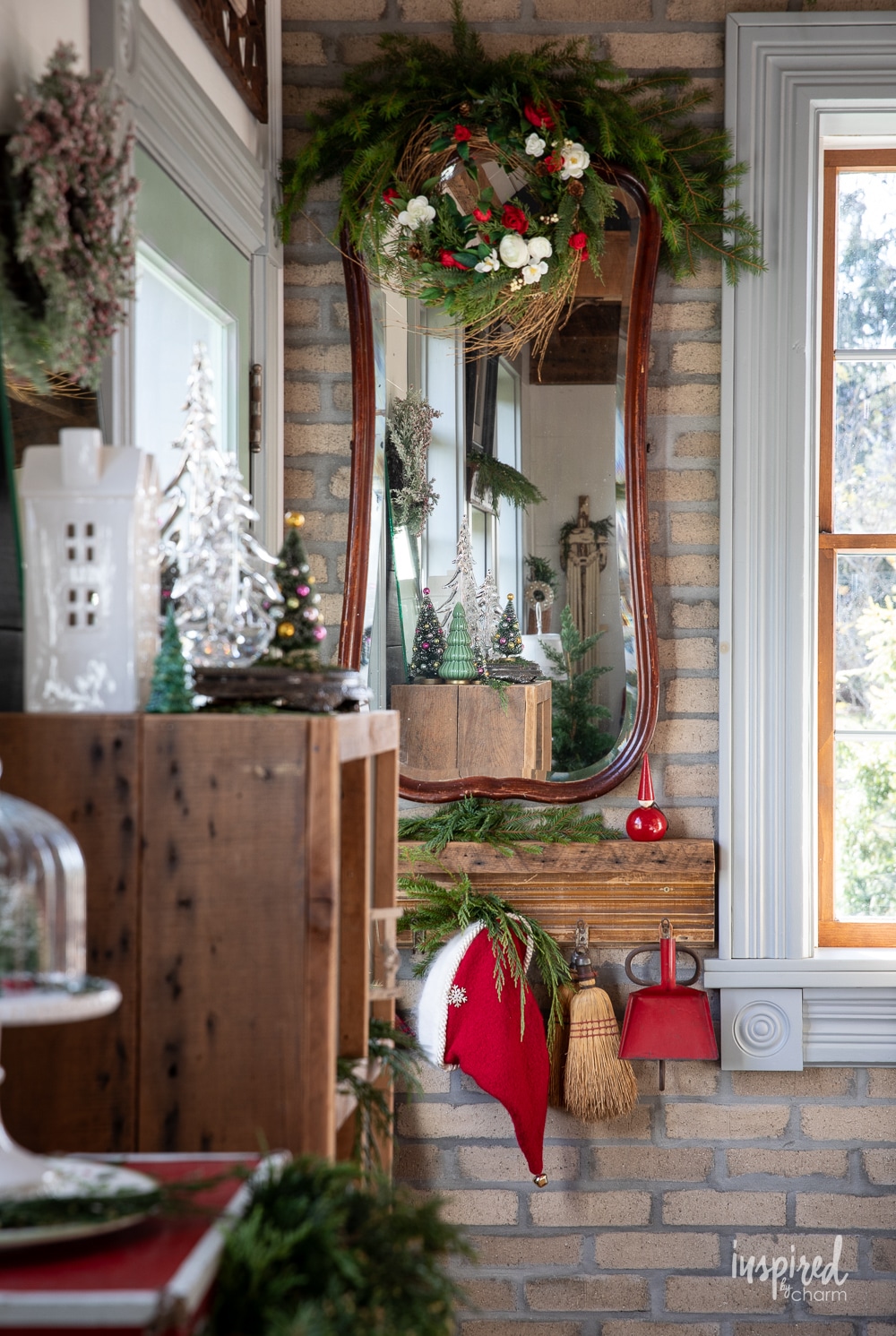 mirror and shelf with christmas decor.
