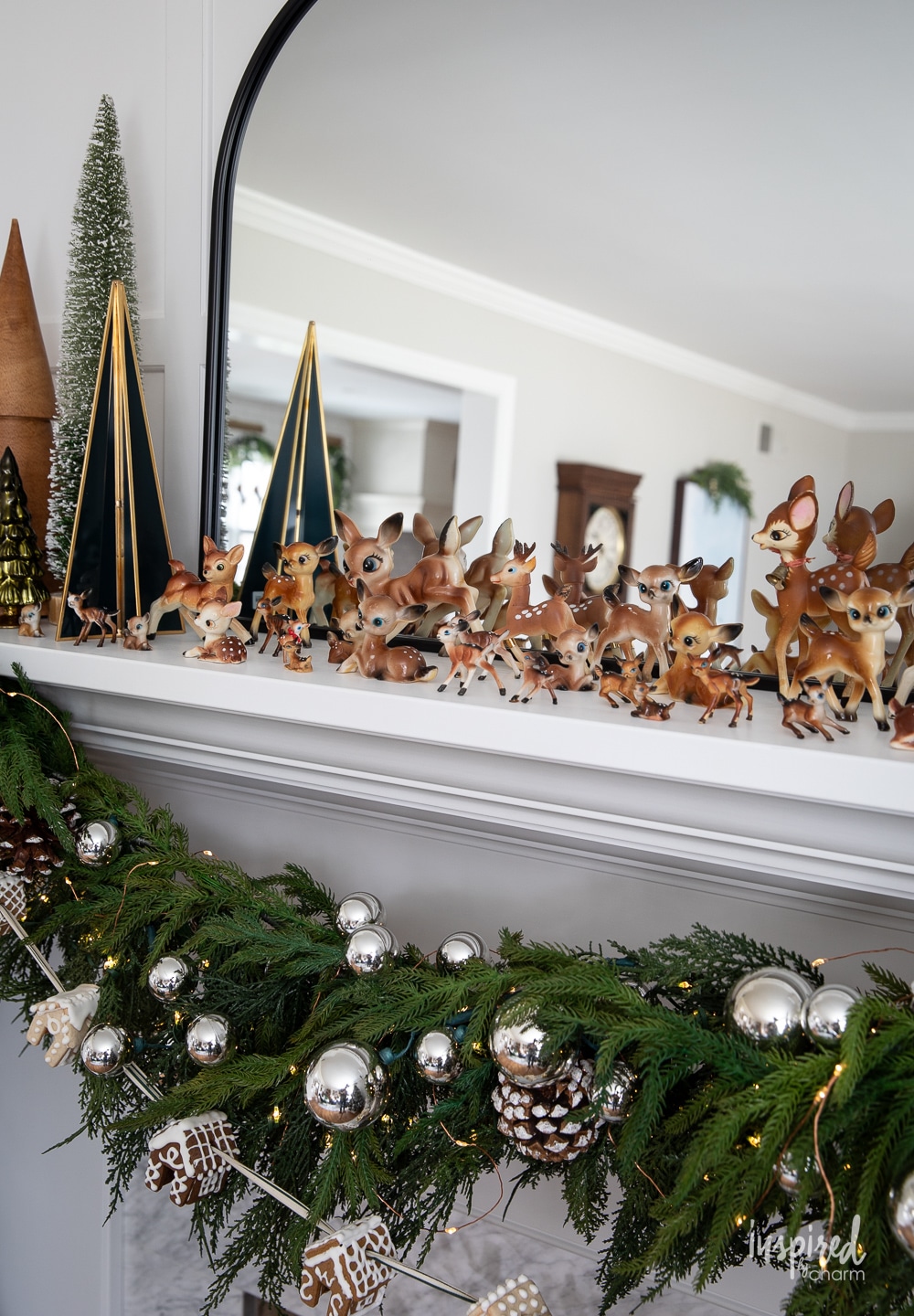 vintage collection of plastic deer on a mantel. 