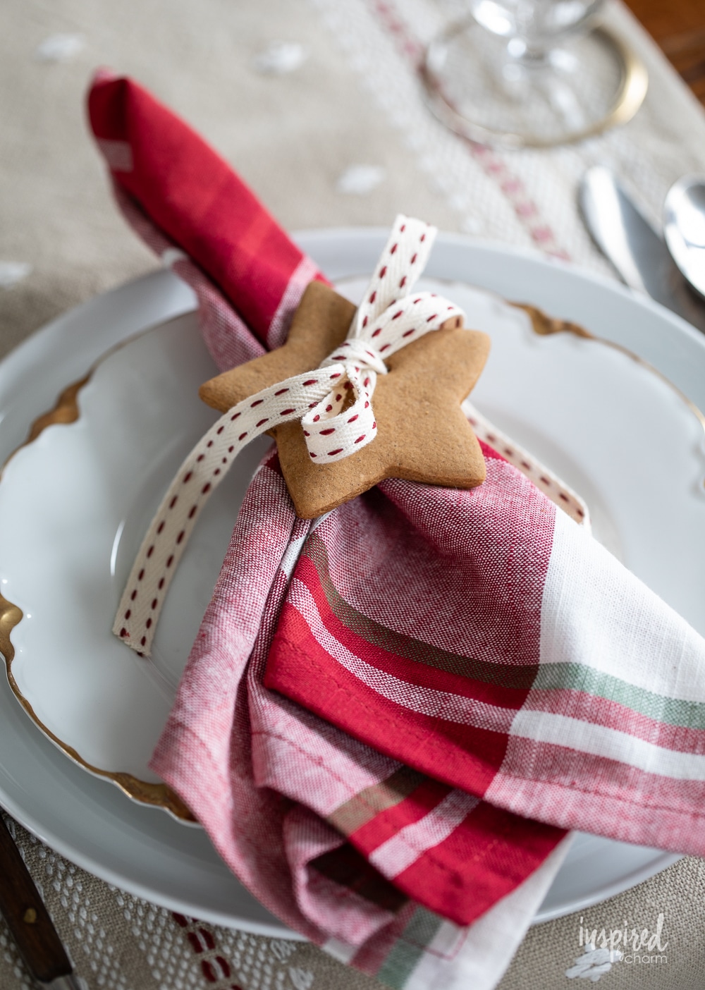 star gingerbread cookie with ribbon used as a napkin ring. 