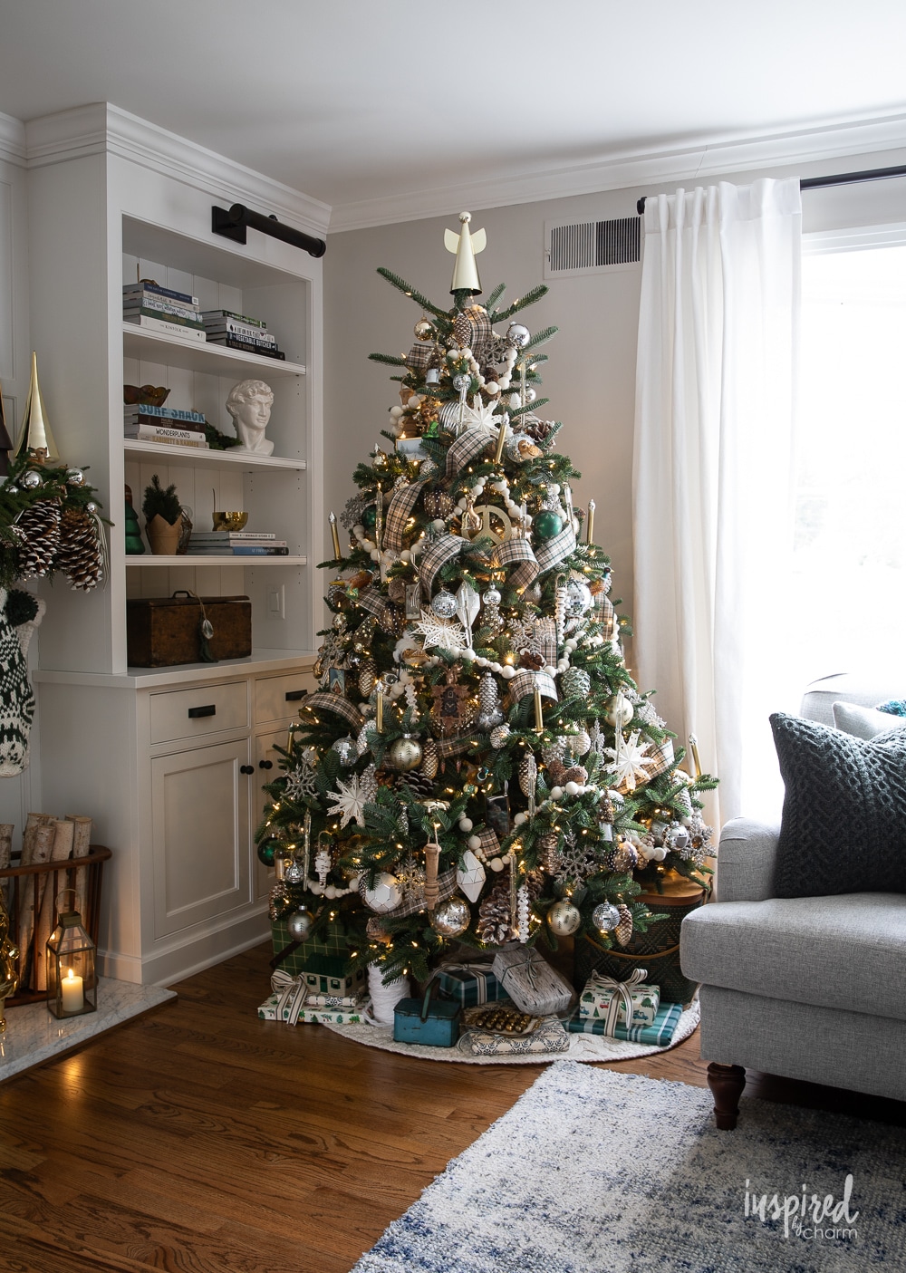 traditional woodland christmas tree in a living room.