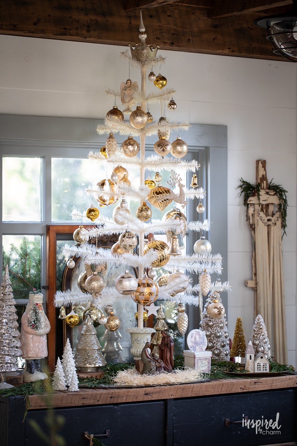 white feather tree filled with ornaments.