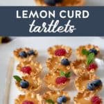 lemon curt tartlets on a plate garnished with fresh mint and berries.