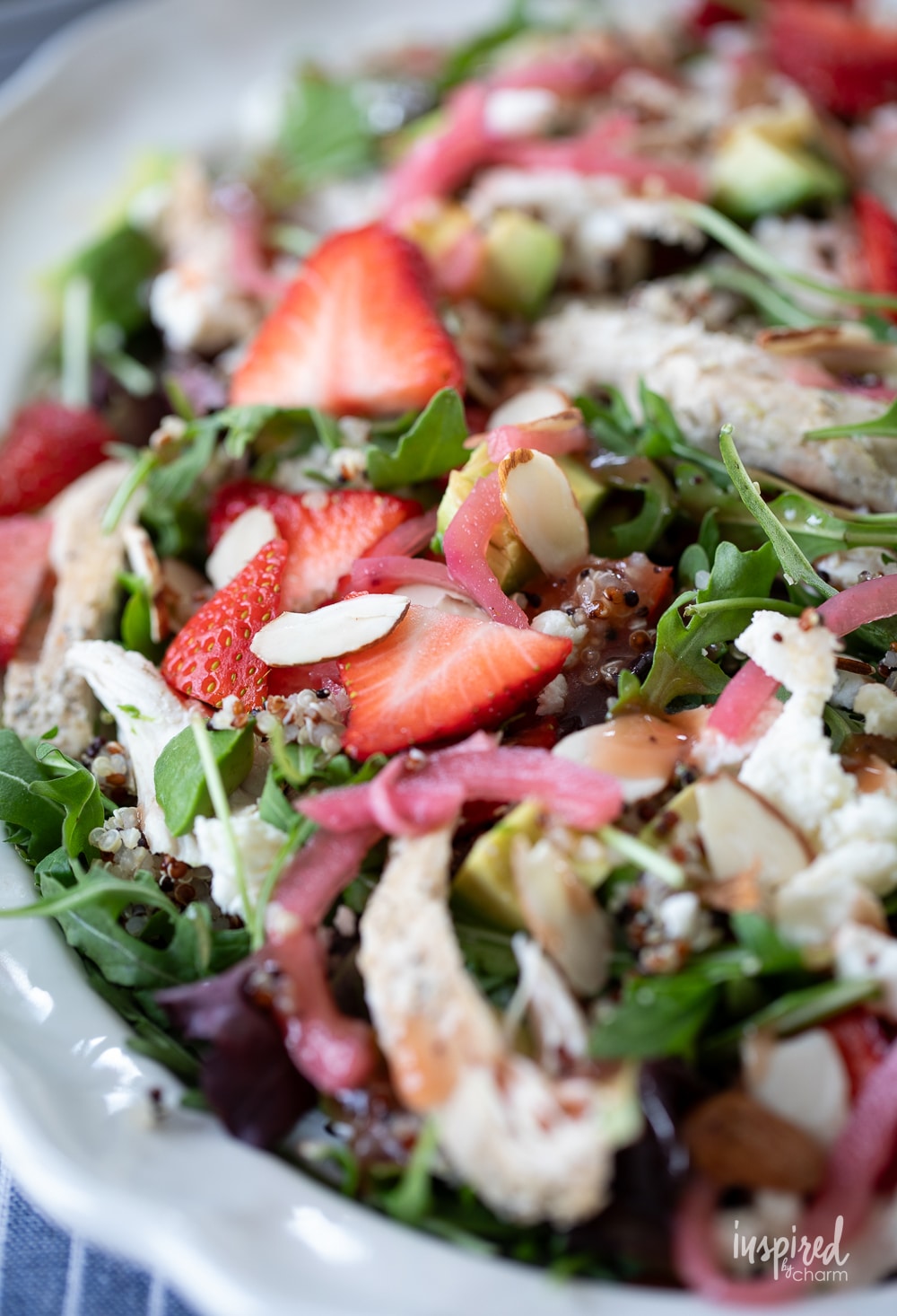 Chicken Quinoa Strawberry Salad with sliced almonds and red onions. 