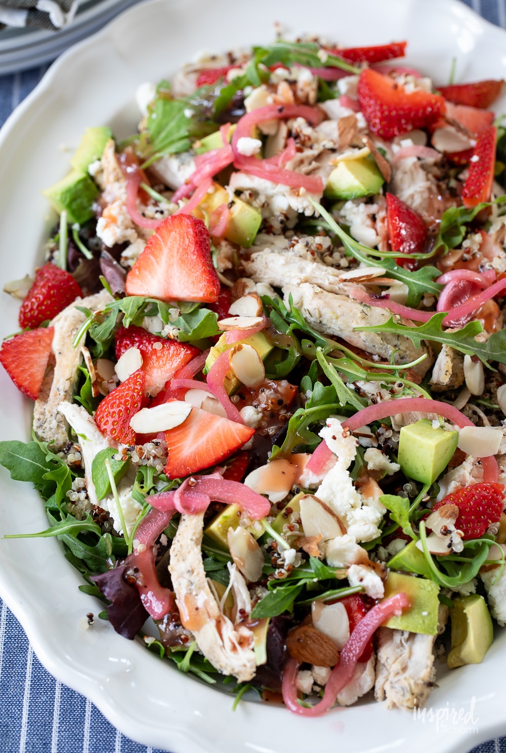 Chicken Quinoa Strawberry Salad served on a large white platter.