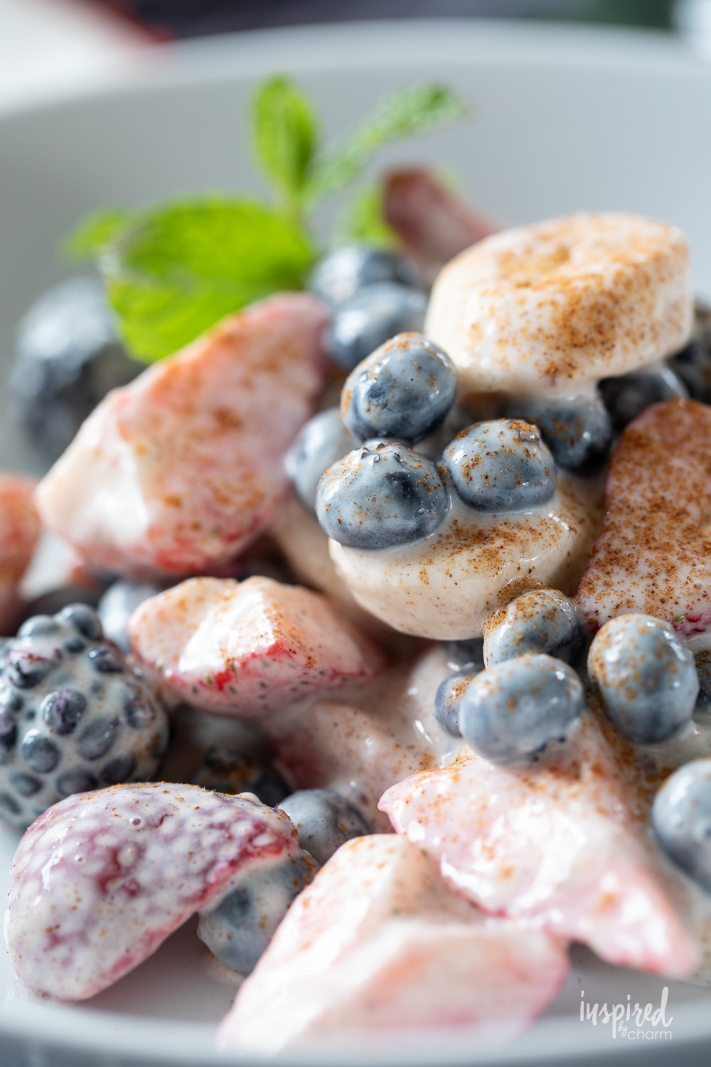 berries and banana fruits salad mixed with yogurt.