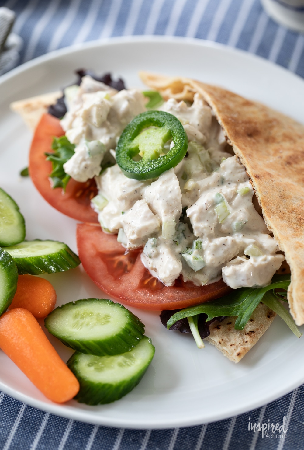 Jalapeño Honey Chicken Salad served in a pita with vegetables. 