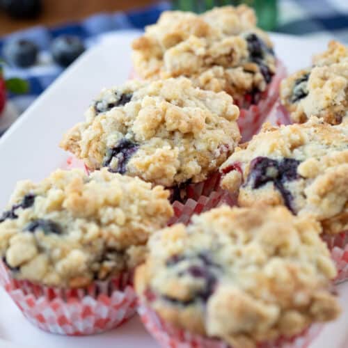 size Triple Berry Muffins on a white platter.